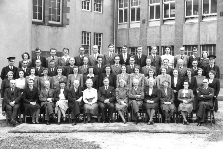 Group photograph of people in front of building